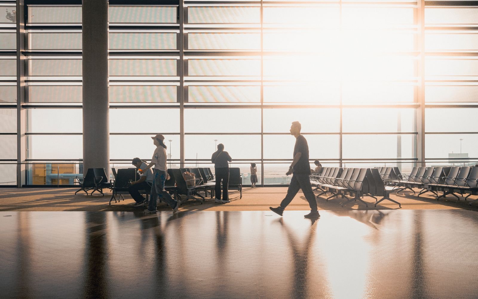 Travellers inside a terminal.