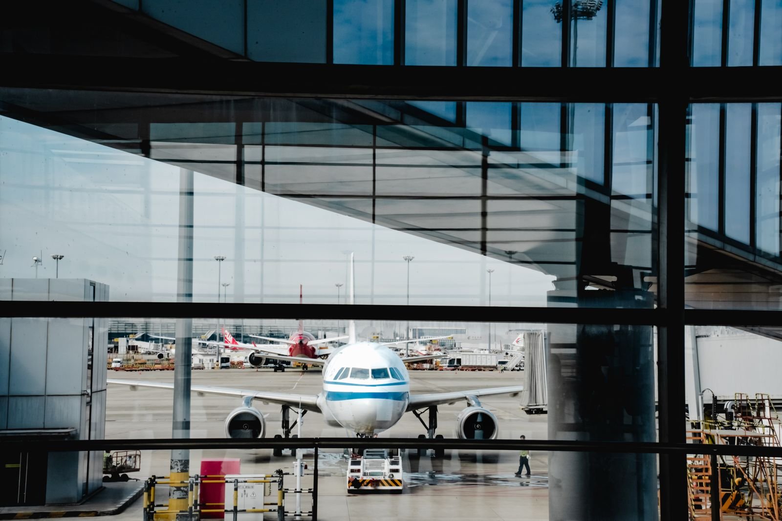 Aircraft seen through a terminal window.
