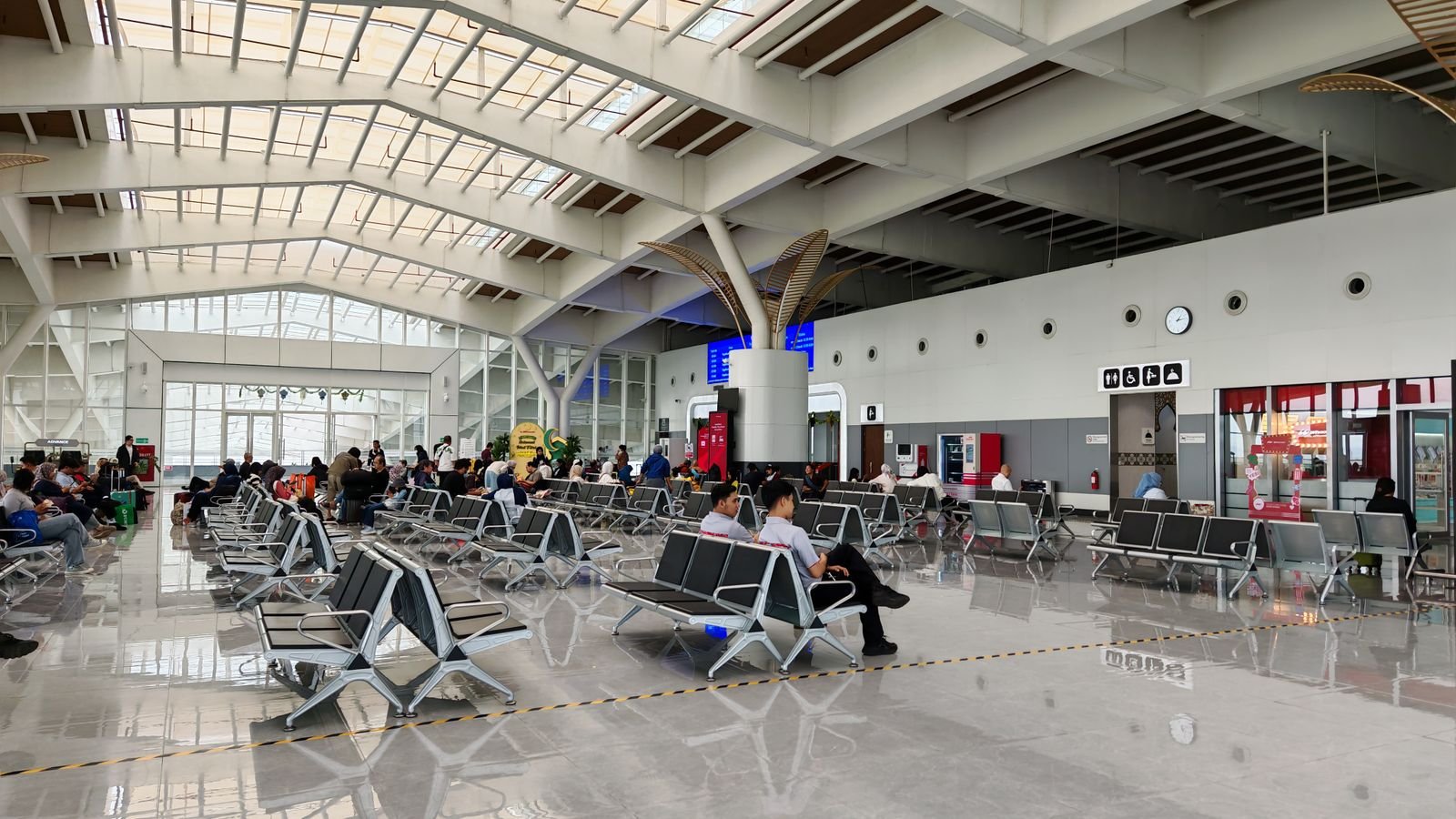 A terminal hall with seating and walkways.